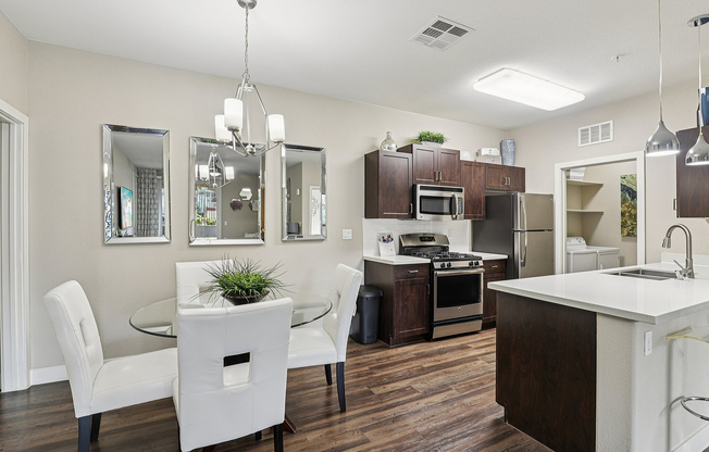 Dining Area and Kitchen with Stainless Steel Appliances