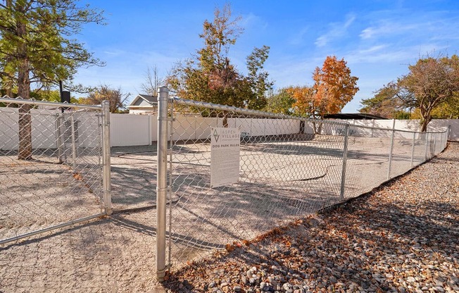 a chain link fence with a sign on the gate