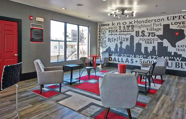 a lounge area with chairs and tables and a wall mural at Mockingbird Flats, Texas