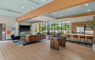 a communal area with a kitchen and a living room with a bar and a table at Baldwyn, Washington, 98125