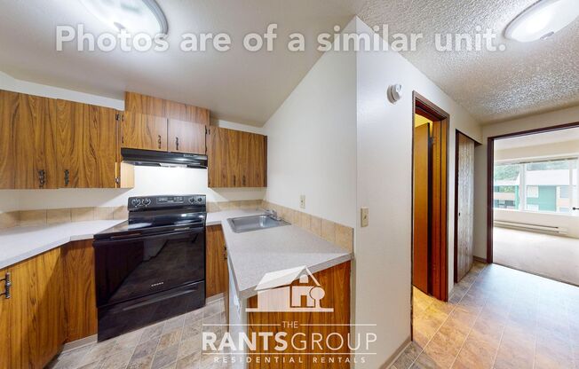 Lovely, wooded 2-bedroom apartment with a large private deck and in-unit washer & dryer!