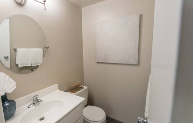 This is picture of the primary half bath in the 823 square foot 2 bedroom apartment at Aspen Village Apartments in the Westwood neighborhood of Cincinnati, OH.
