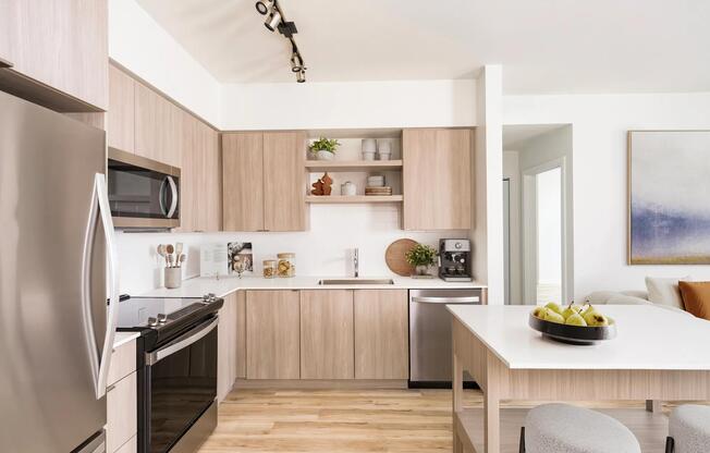 Gourmet kitchens with quartz countertops and custom cabinetry with upgraded pulls and soft close.