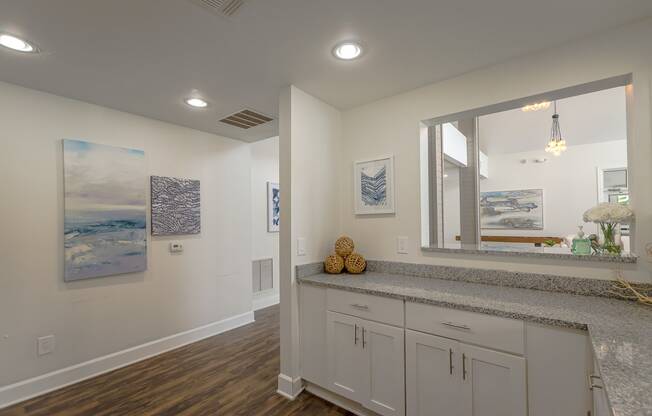 a view of a staircase in a white room with white walls and stairs with crystals