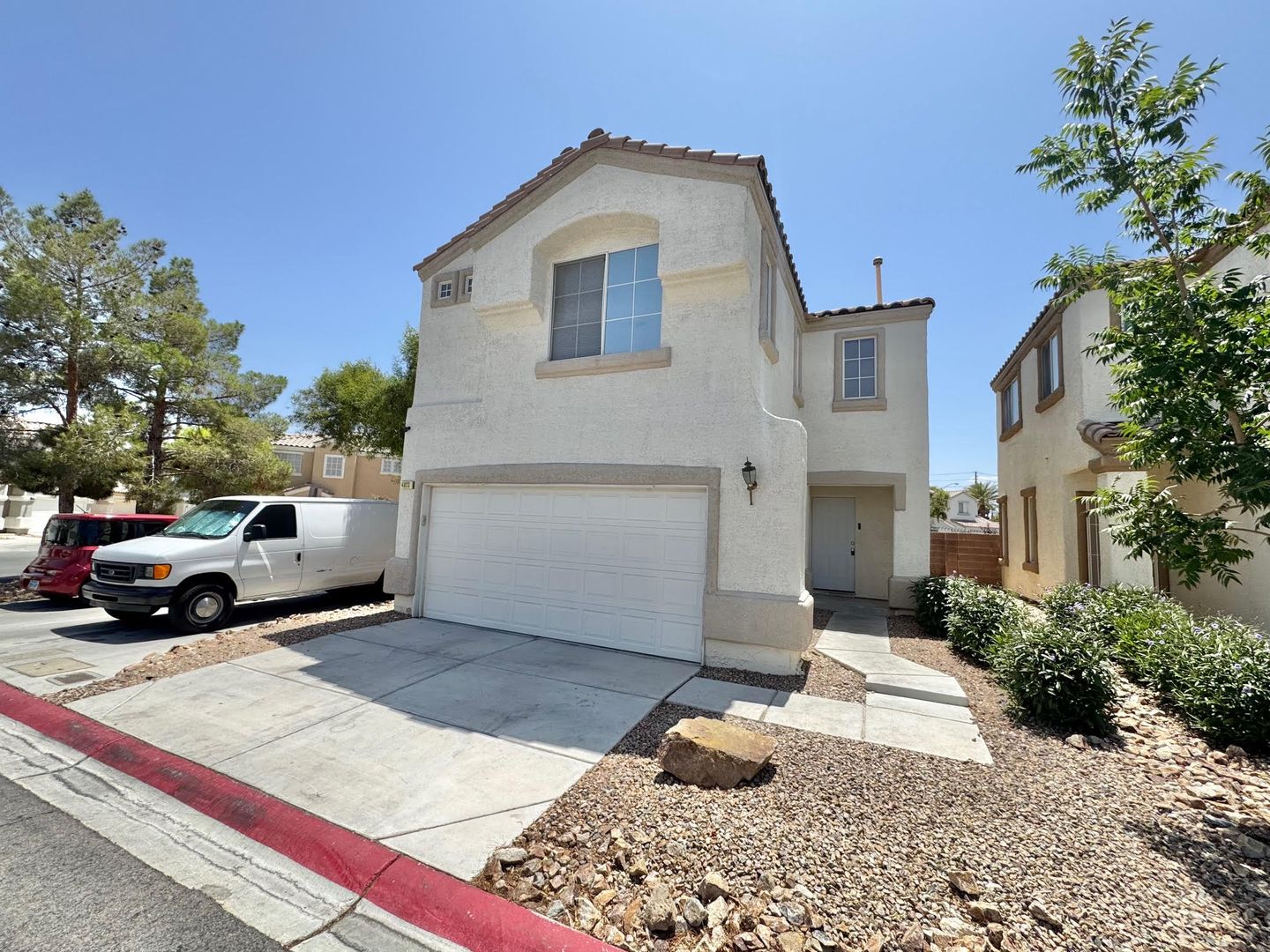 THIS IS A CHARMING TWO-STORY NORTH LAS VEGAS HOME WITH 2 BEDROOMS, 2.5 BATHS AND A TWO-CAR ATTACHED GARAGE. FEATURING TILE AND CARPET FLOORING, NEUTRAL PAINT, AND BLINDS THROUGHOUT, THE MAIN LEVEL OFFERS AN OPEN LIVING AND DINING AREA THAT FLOWS INTO A KI