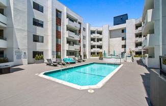 a pool is shown in front of an apartment building  at Masselin Park West, California, 90036