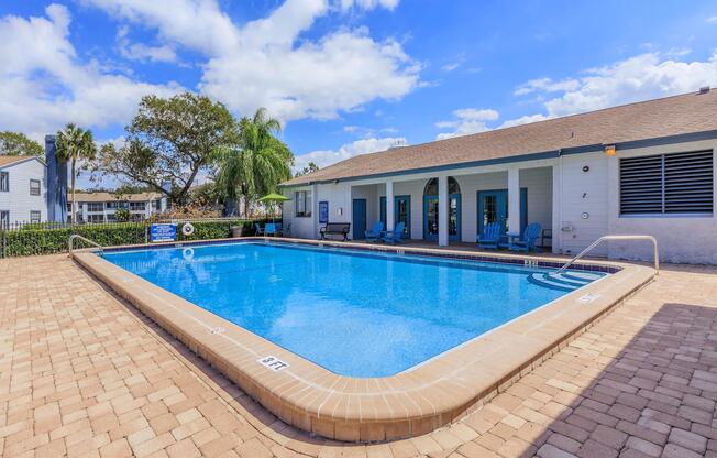 a pool next to a brick building