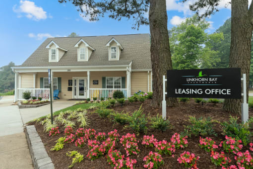 a building with a leasing office sign in front of it at Linkhorn Bay Apartments, Virginia Beach, VA