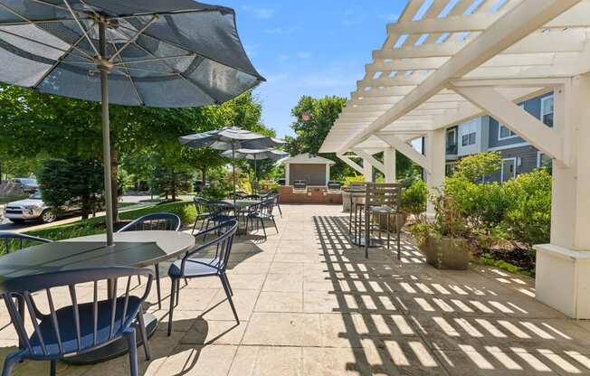 Outdoor courtyard with grills and seating