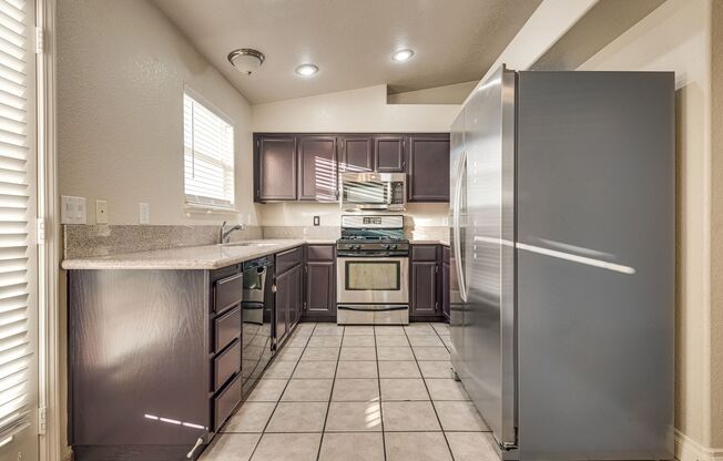 Beautiful 3 Bedroom, 2 Bathroom Townhouse w/ attached 1 Car Garage & Community Pool.