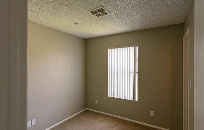 an empty room with a window in it