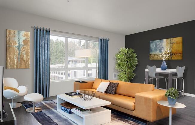 A living room with a yellow couch, a white coffee table, and a large window with blue curtains. at Kirkland Crossing Apartments, Kirkland, WA