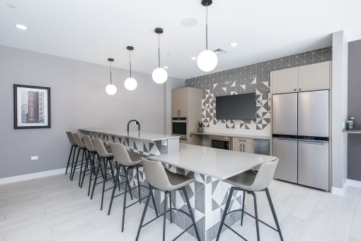 a kitchen with a long island with a white countertop