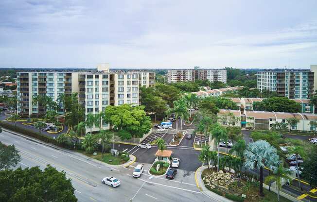 an aerial view of a city street with buildings and trees at Fairways of Inverrary, Florida, 33319