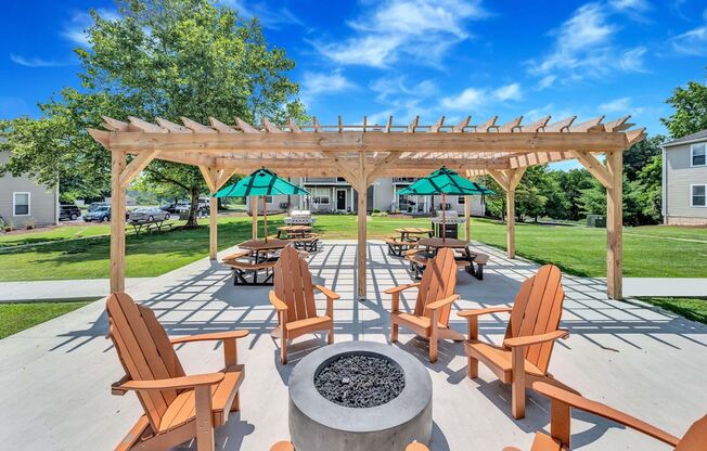 Cozy fire pit with seating and covered grilling pavilion