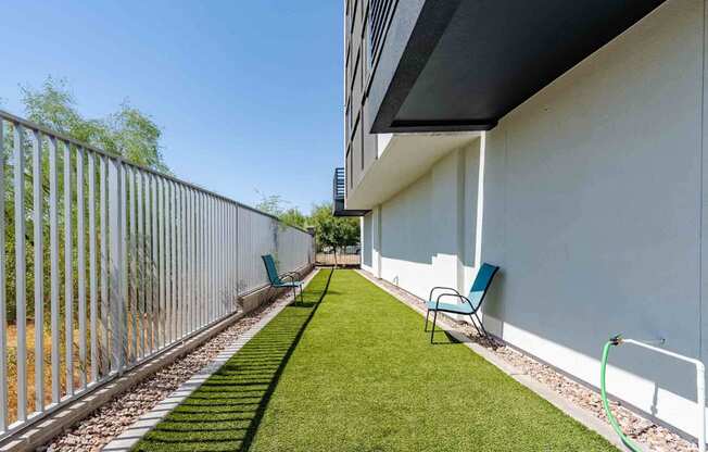 our apartments have a private patio with chairs and a dog park
