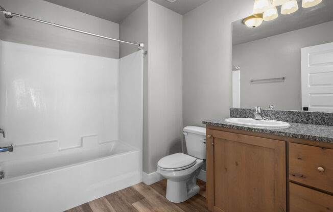 a bathroom with a sink toilet and a bath tub