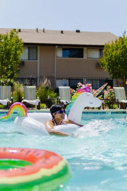 A resident enjoys the pool at Cranbrook.