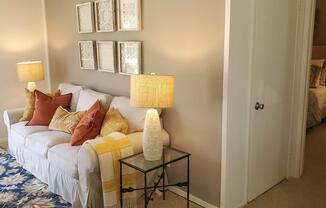 living room and hallway with carpet