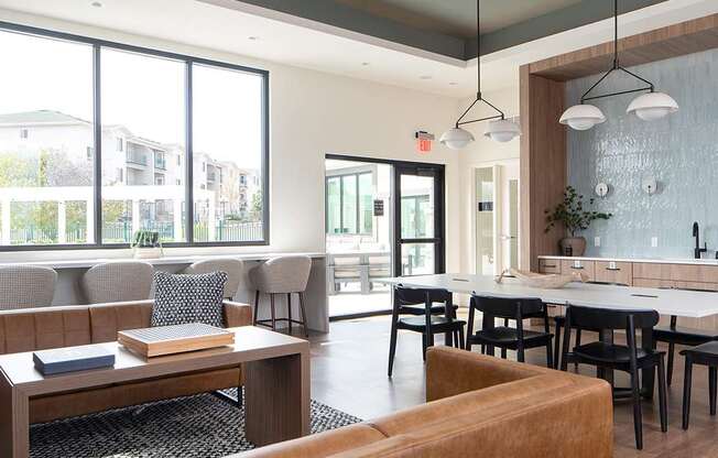 A modern living room with a brown sofa and a coffee table.