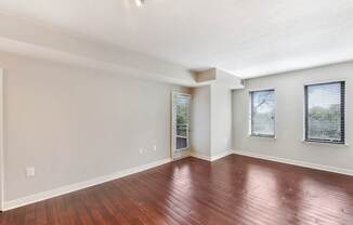 A room with wooden floors and white walls.