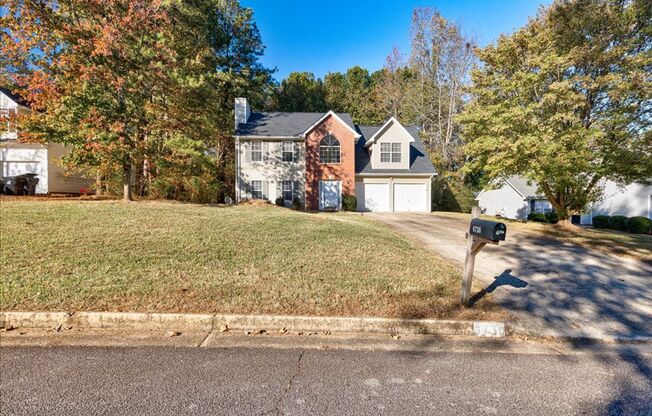 Welcome to this lovely 3-bedroom home with FULL STAINLESS APPLIANCES AT MOVE-IN in Douglasville, GA!