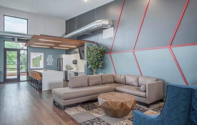 A modern living room with a grey sofa and a wooden coffee table.