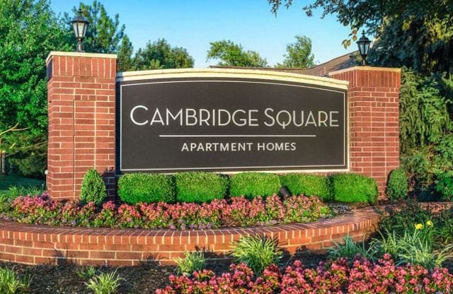 Lush landscaping surrounds you as you drive at Cambridge Square Apartments, Overland Park, KS 66211