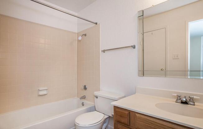 a large white tub sitting next to a sink