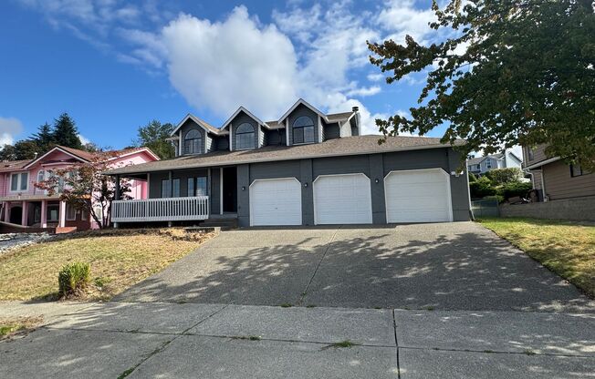 Bright NE Tacoma Home 3 Bedroom 2 Bath, Peaking Sound View with a 3 Car Garage & Fenced Yard!