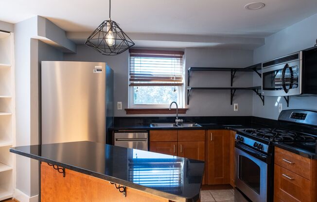 Bright and Peaceful One-Bedroom with Built-Ins and Rooftop Views