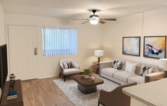 a living room with couches and a table and a ceiling fan