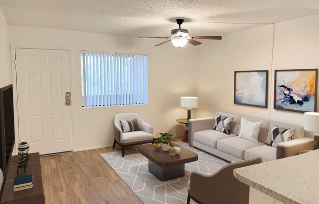 a living room with couches and a table and a ceiling fan