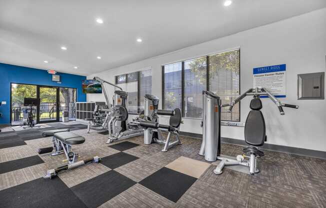 a gym with weights and cardio equipment at the preserve at greatstone  at Sunset Ridge, San Antonio, TX