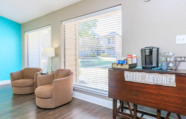 a living room filled with furniture and a large window