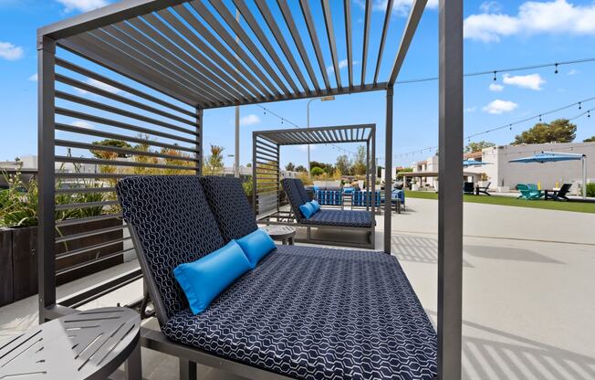 a patio with lounging daybeds