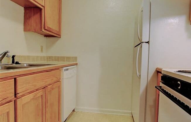 Image of kitchen with cabinets and appliances