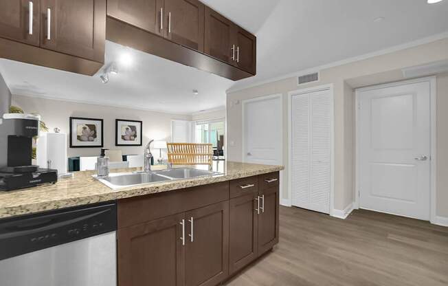 A kitchen with brown cabinets and a black stove top oven.