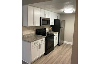 a stainless steel refrigerator in a kitchen