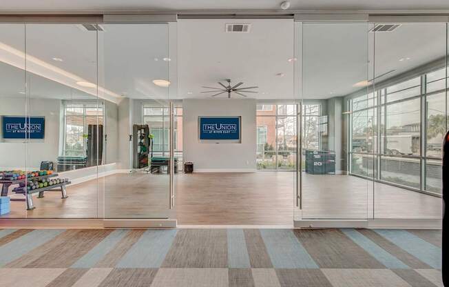 A glass wall with a sign that says "The Union" on it.