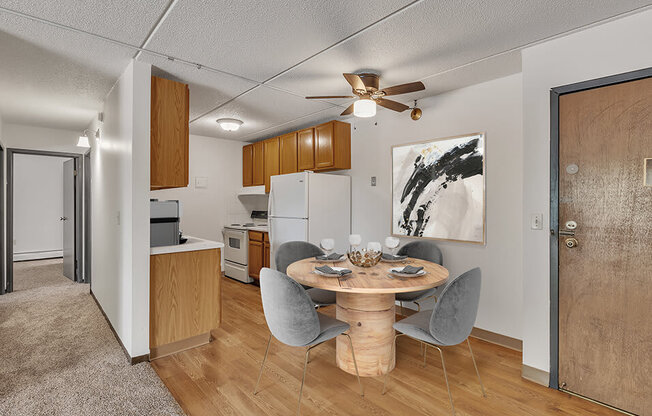 a kitchen and dining room with a table and chairs