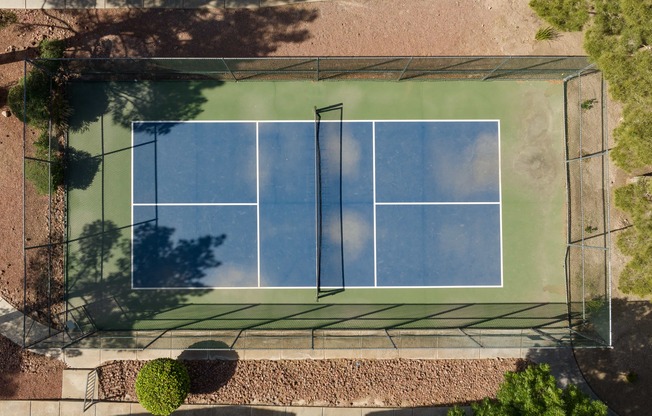 an aerial view of a tennis court on a