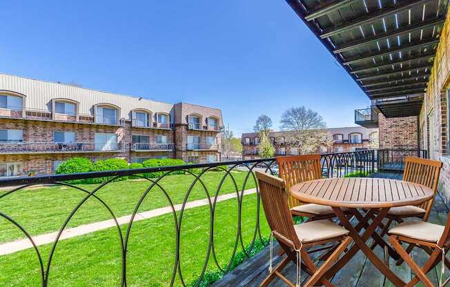 2x1H Balcony with Table and Chairs at Waldo Heights, Missouri