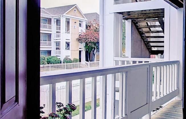 Image of balcony with plants and stairs