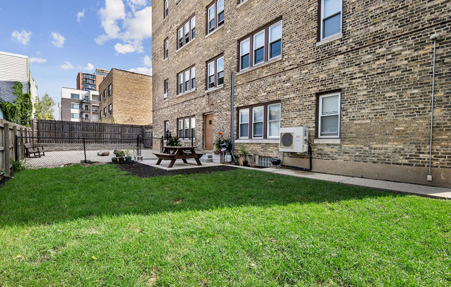 the yard of Cambridge manor with picnic area and dog park