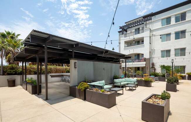 A patio area with a bar and seating area.