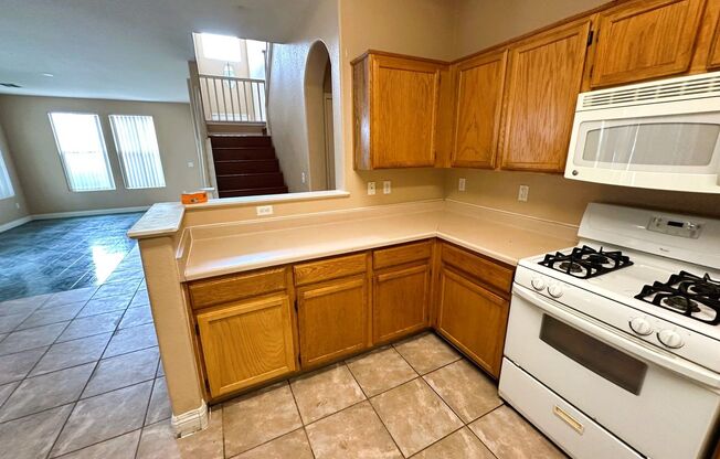 Perfect family home in the gated Cactus Springs community with the master bedroom & bath on the first floor!