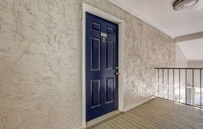 a blue front door to an apartment home at Veridian at Sandy Springs