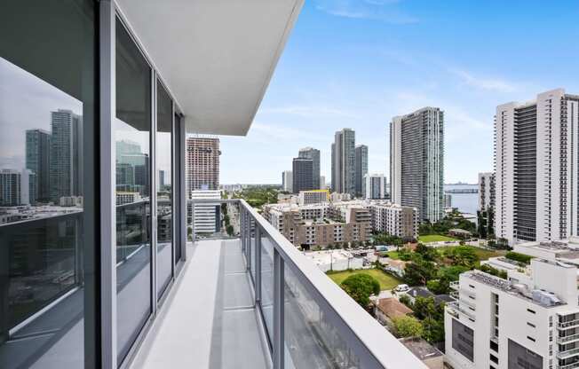 a balcony with a view of the city