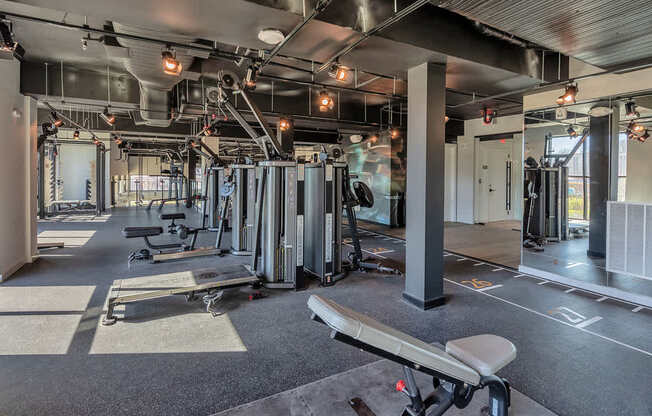Bi-level fitness studio with weight machines